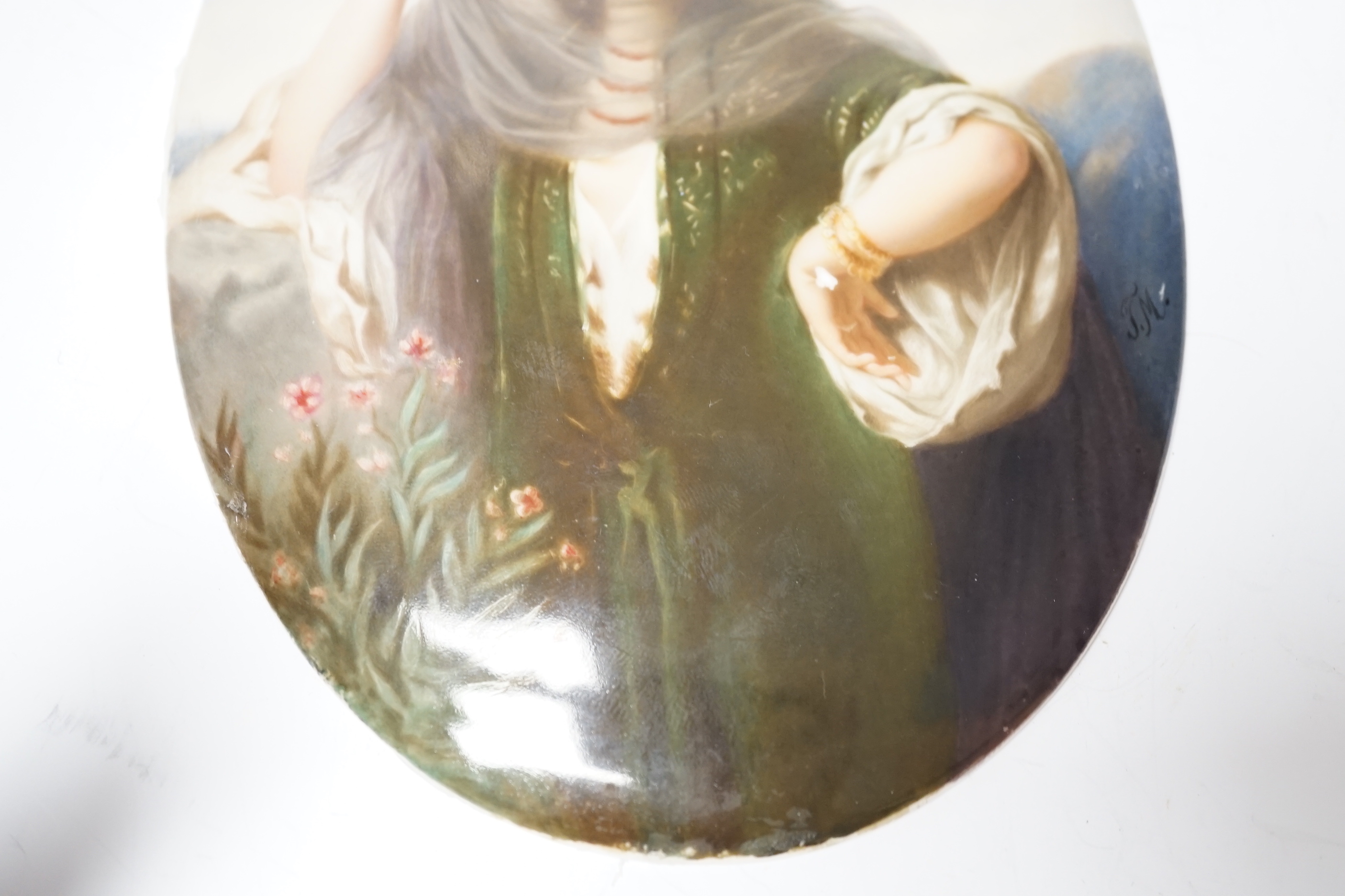 A Berlin KPM painted porcelain oval plaque, painted with a Persian lady, initialled JM, 18 x 13cm